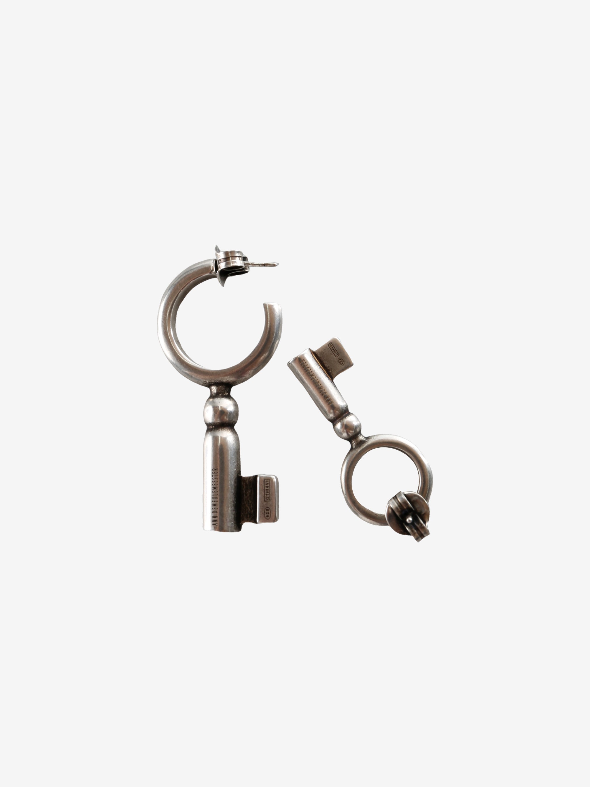 Close up of the grey earrings, showing texture of the silver fabric