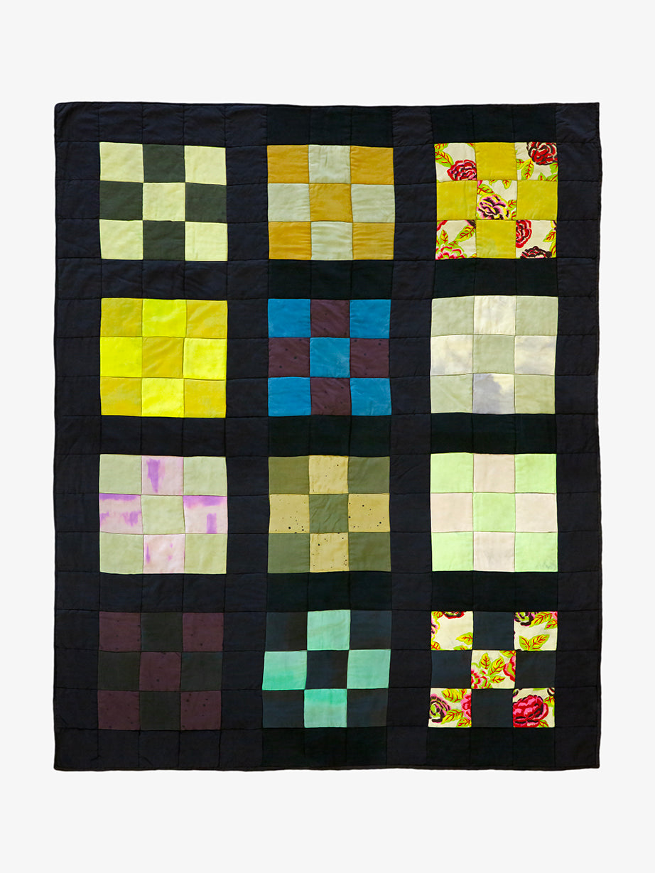 Colorful quilt with square patterns on black