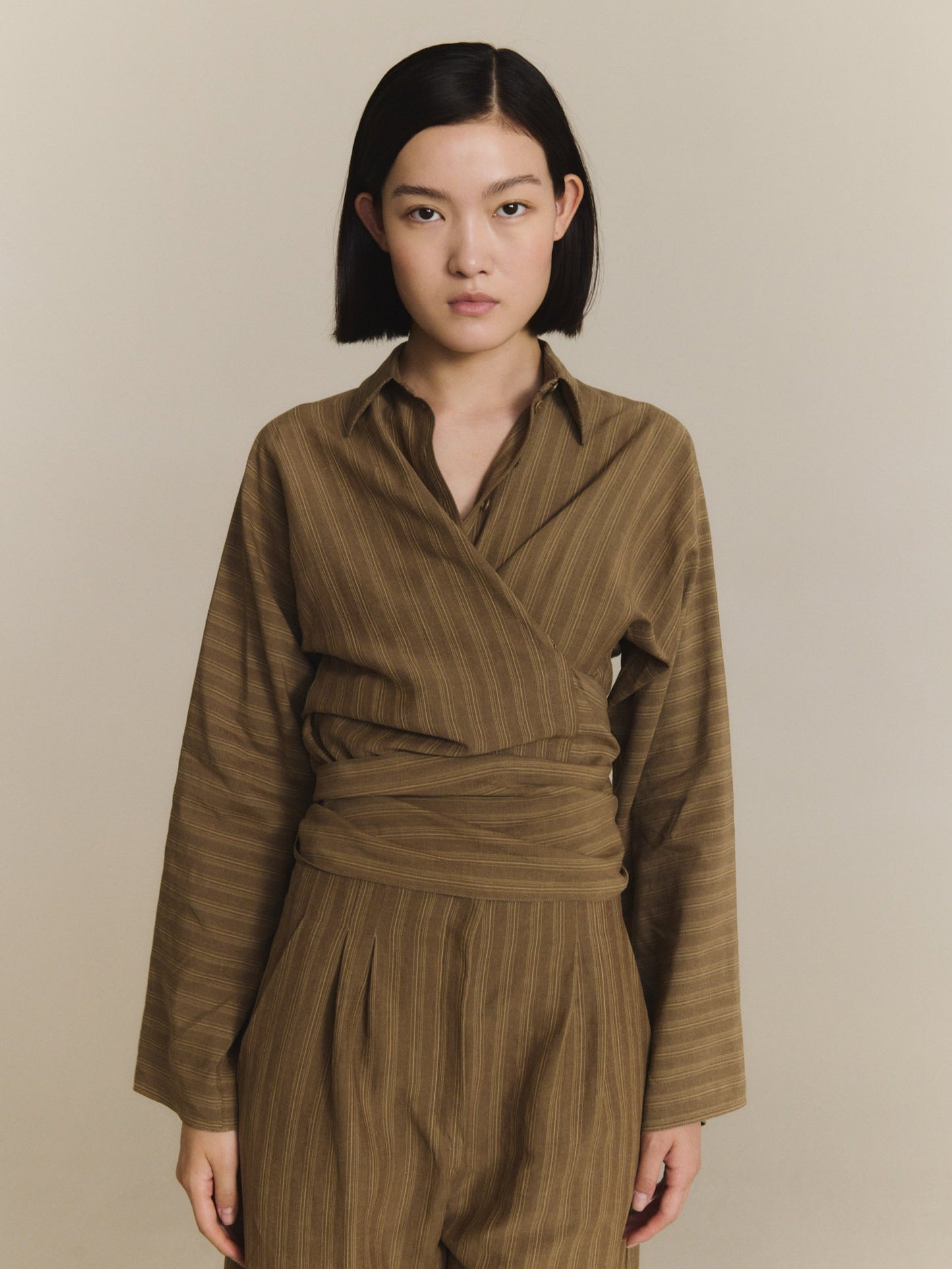 Brown pants worn by a person, showing the pants fit