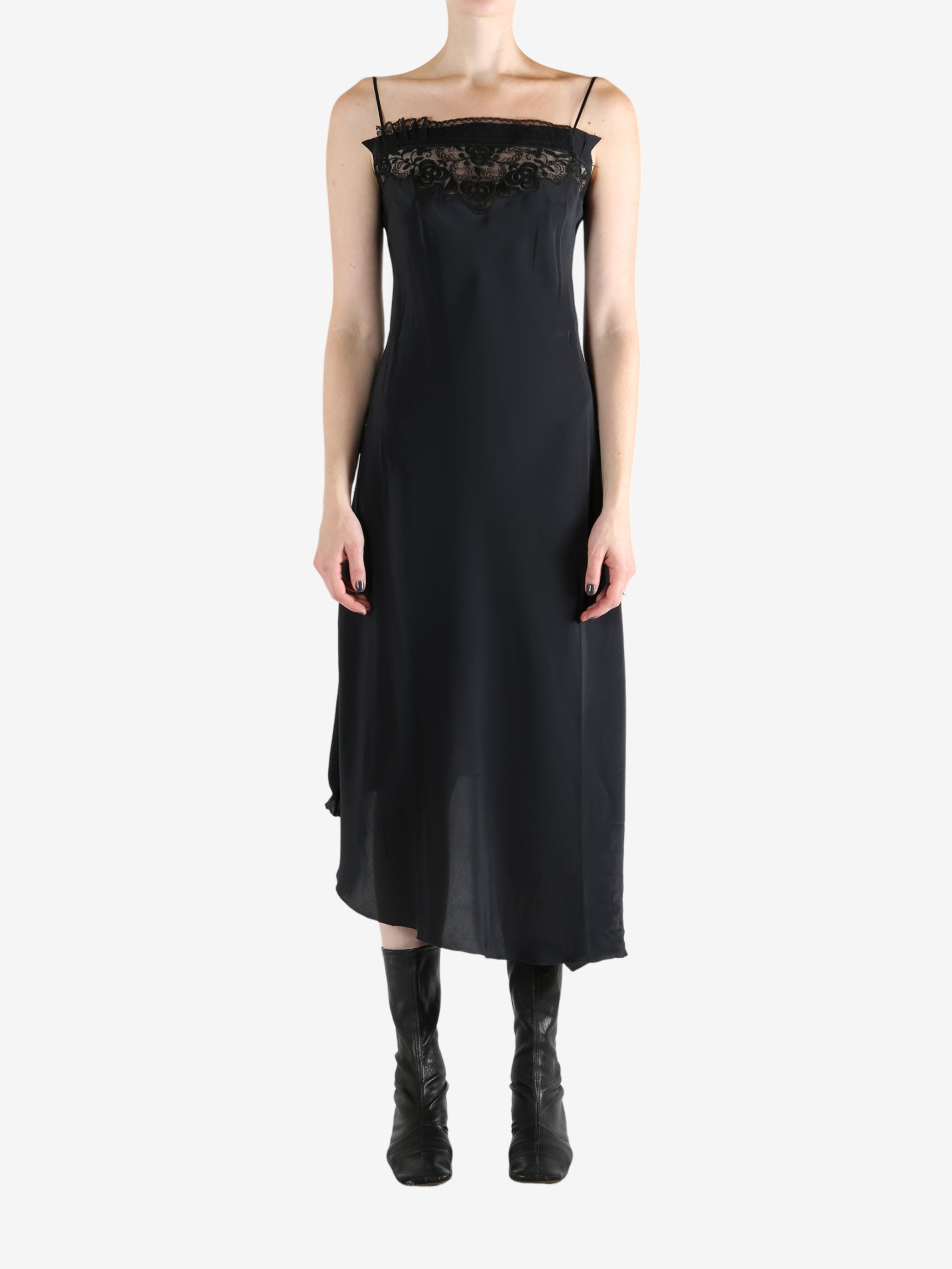 Black dress worn by a person, showing the dress's fit