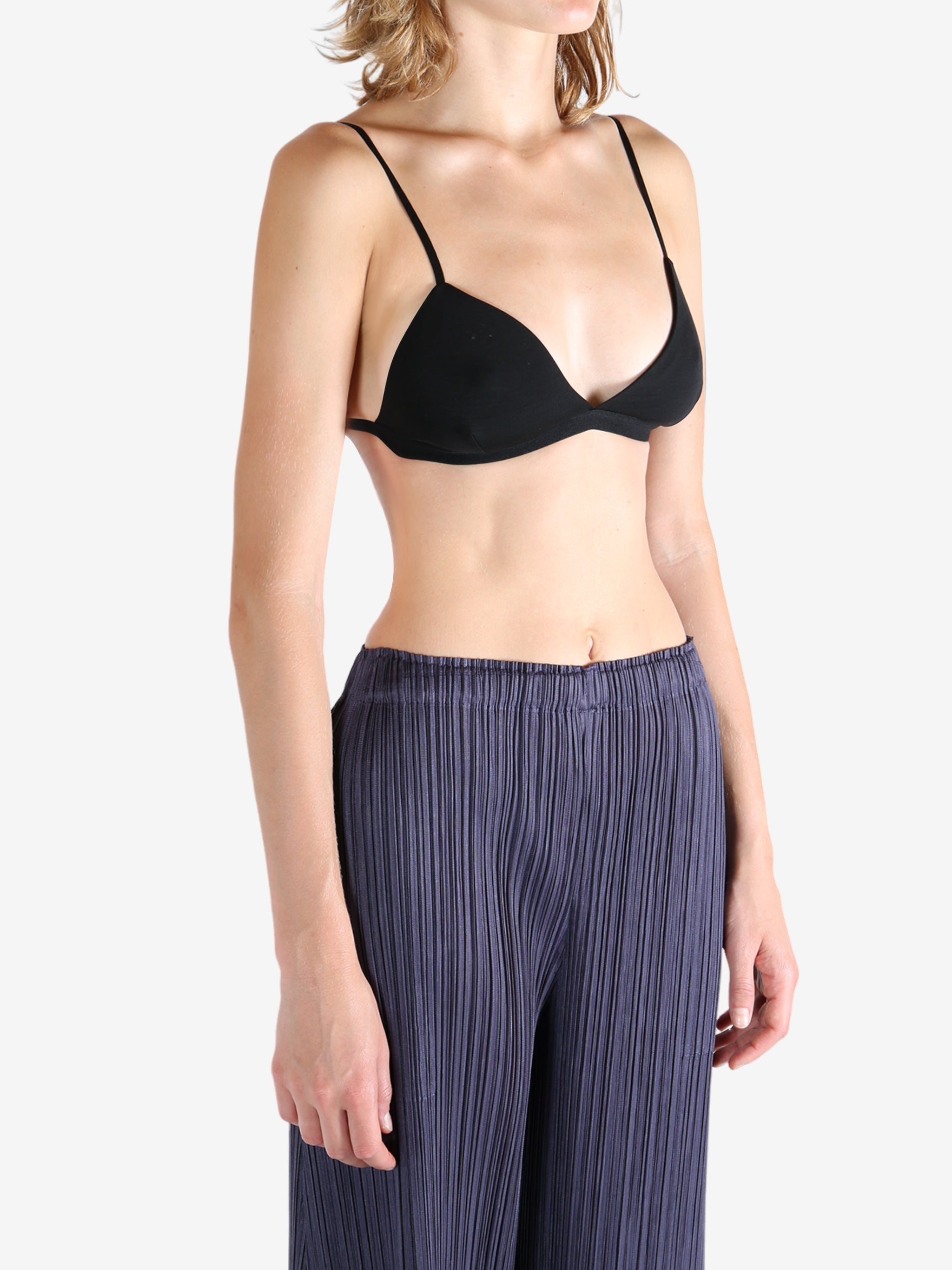 Black bra worn by a person, showing the bra's fit