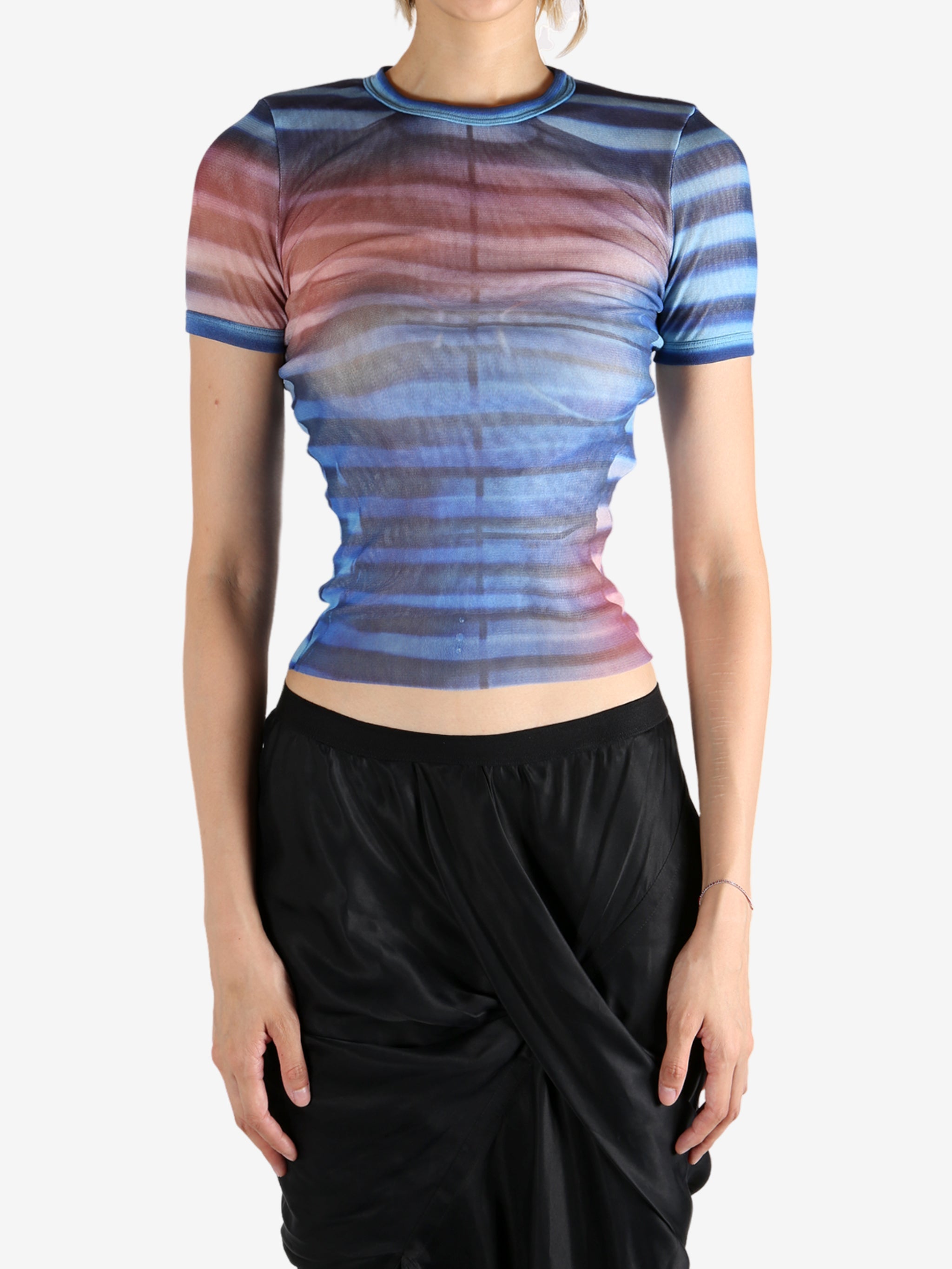 Blue t-shirt worn by a person, showing the shirt's fit