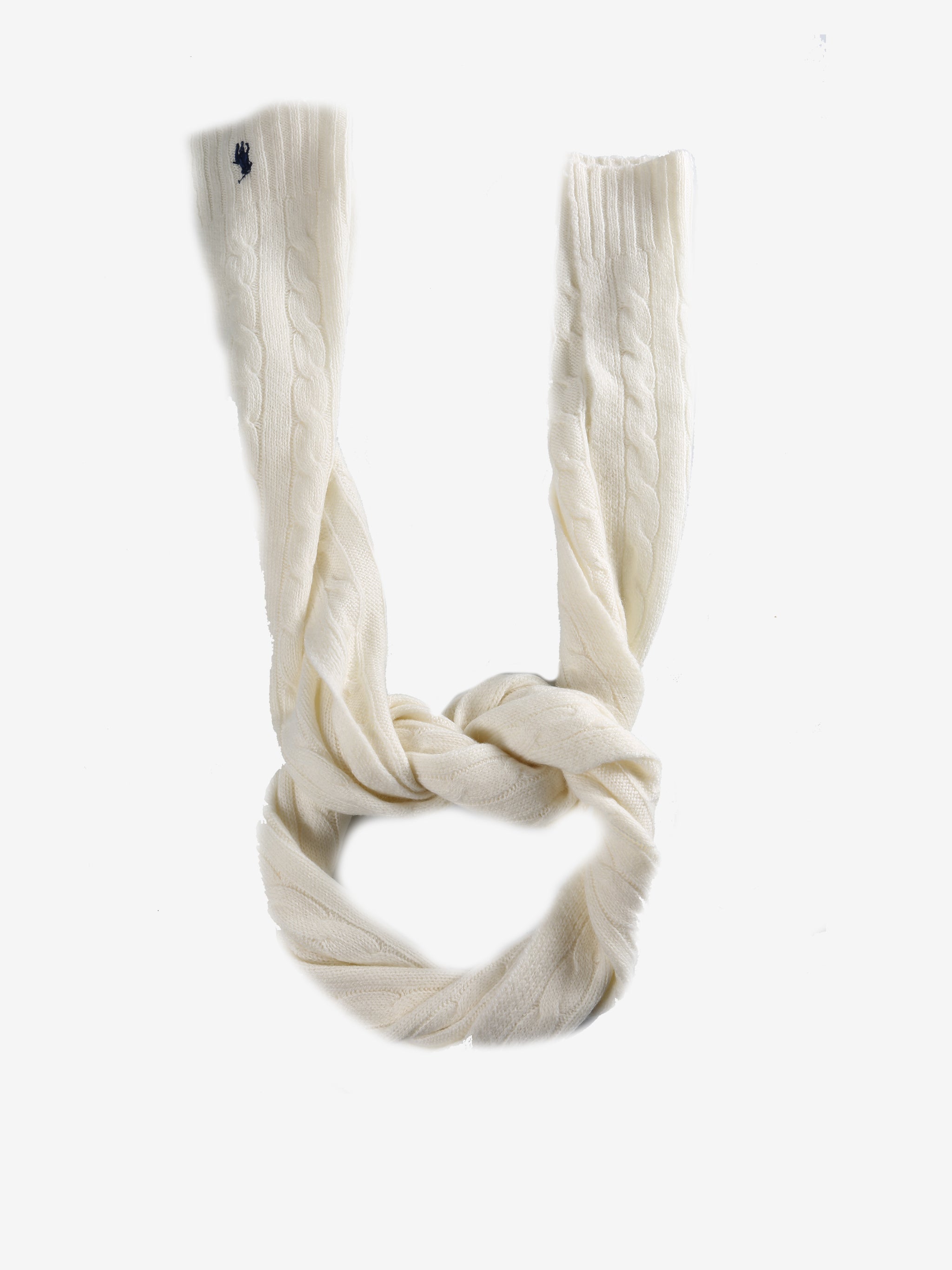 Close up of white scarves, showing texture of the cashmere and wool fabric