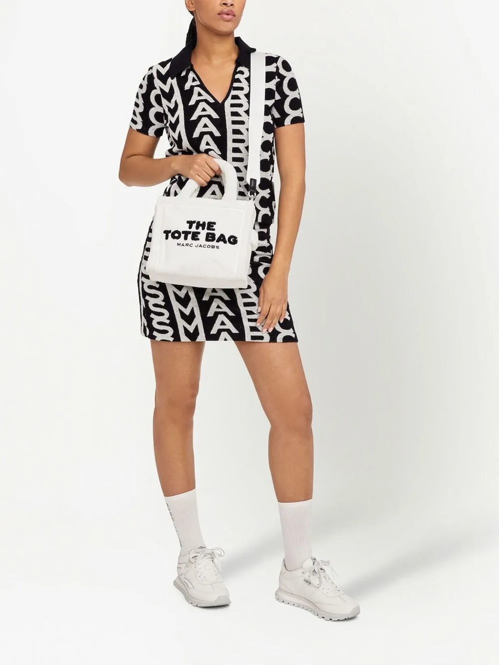 White bag carried by a person, showing the bag's fit