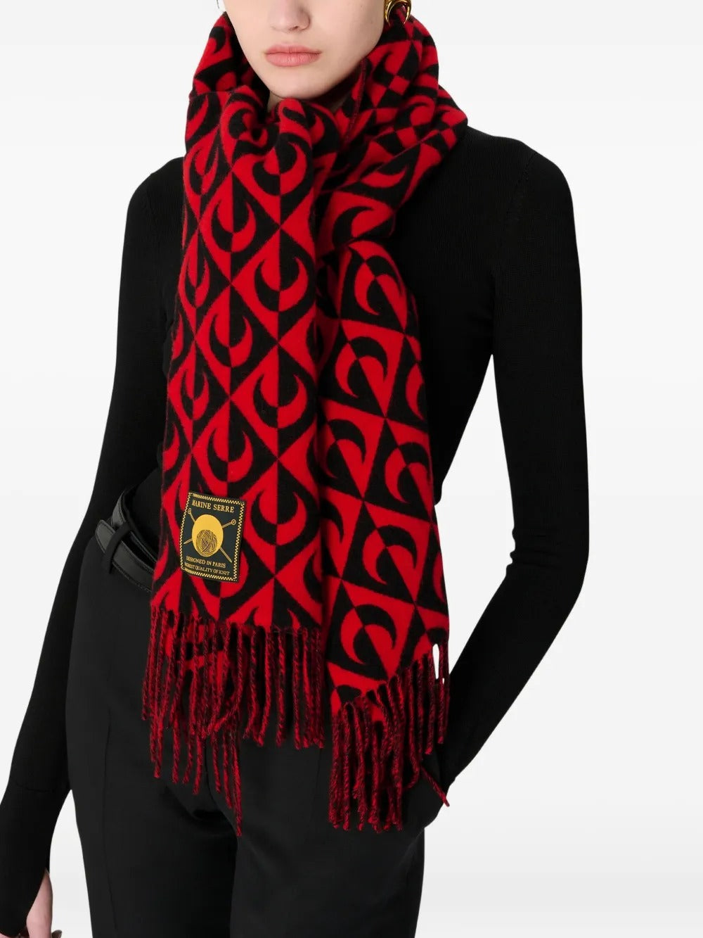 Red scarf worn by a person, showing the bag's fit
