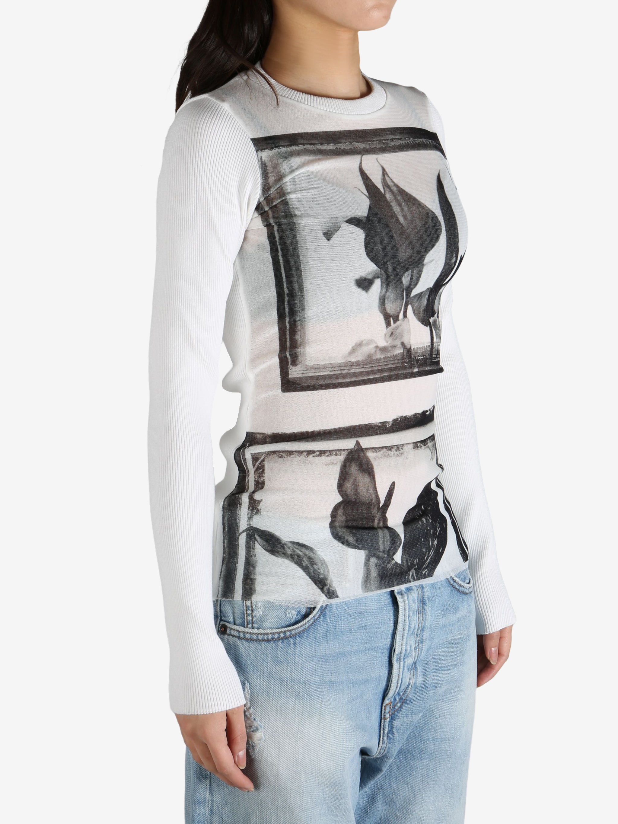 White top worn by a person, showing the top's  fit