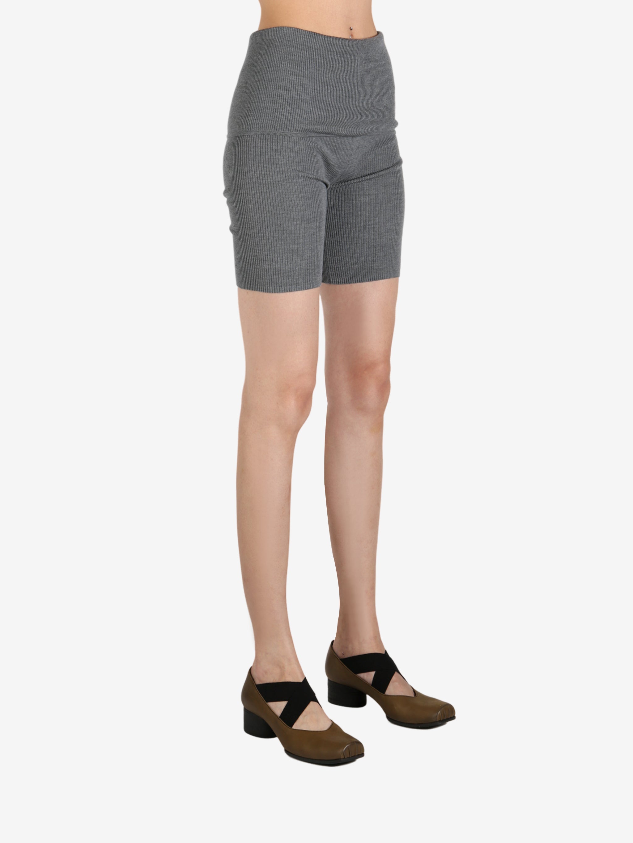 Grey pant worn by a person, showing the pant's fit