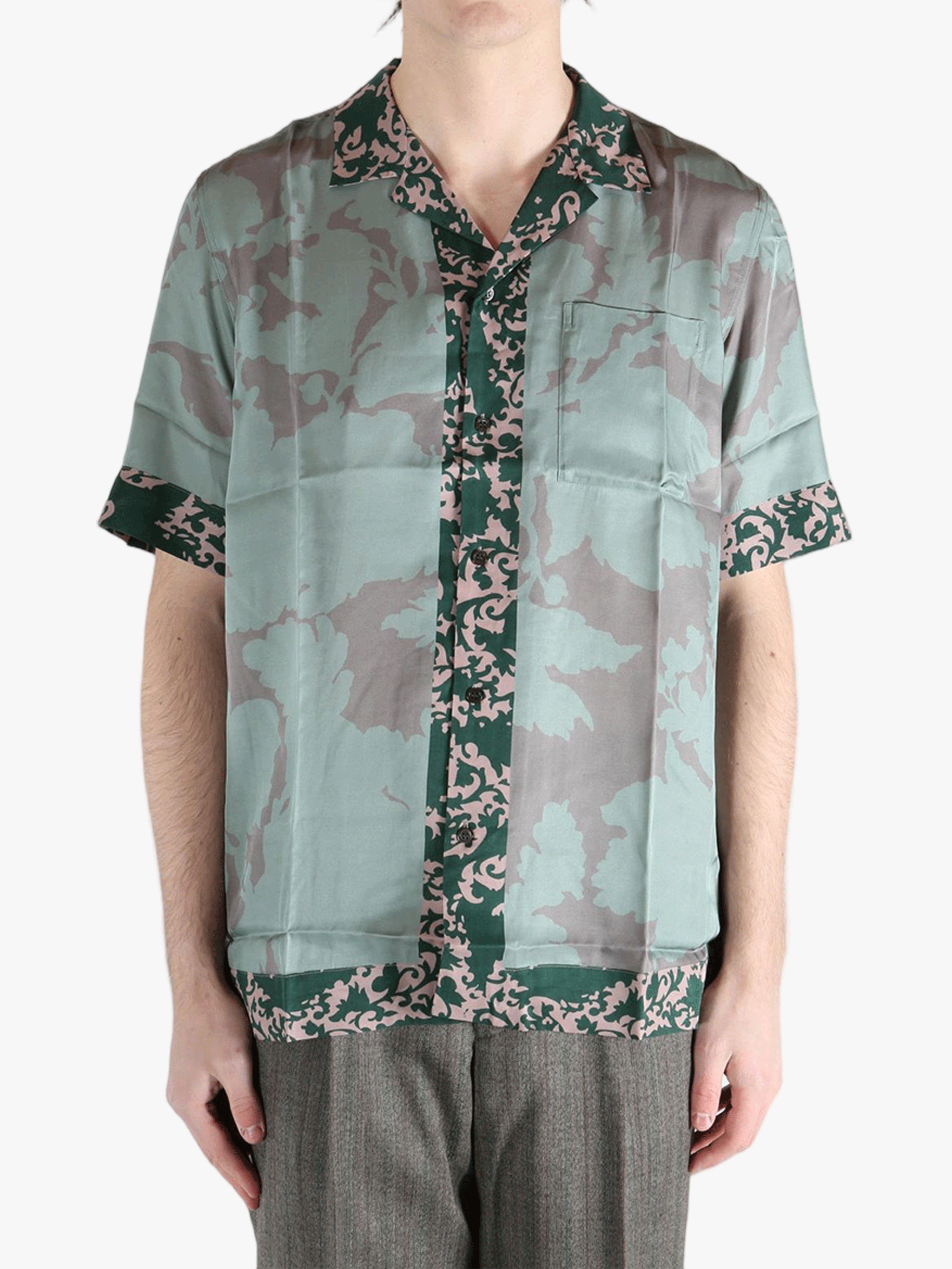 green shirts worn by a person, showing the shirts fit