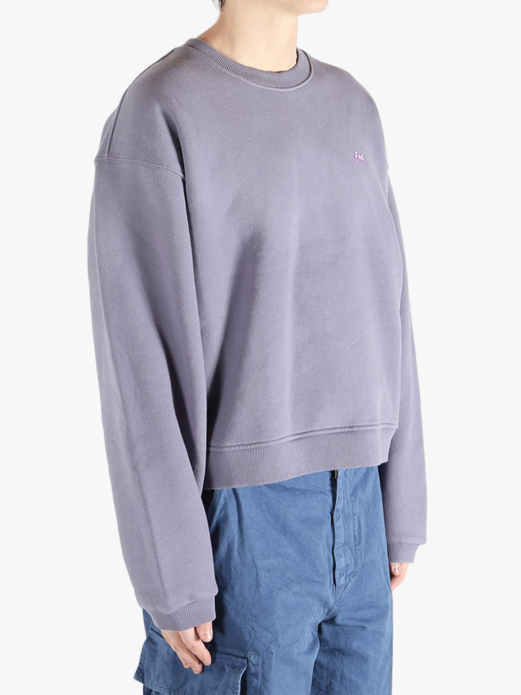 Purple top worn by a person, showing the top fit