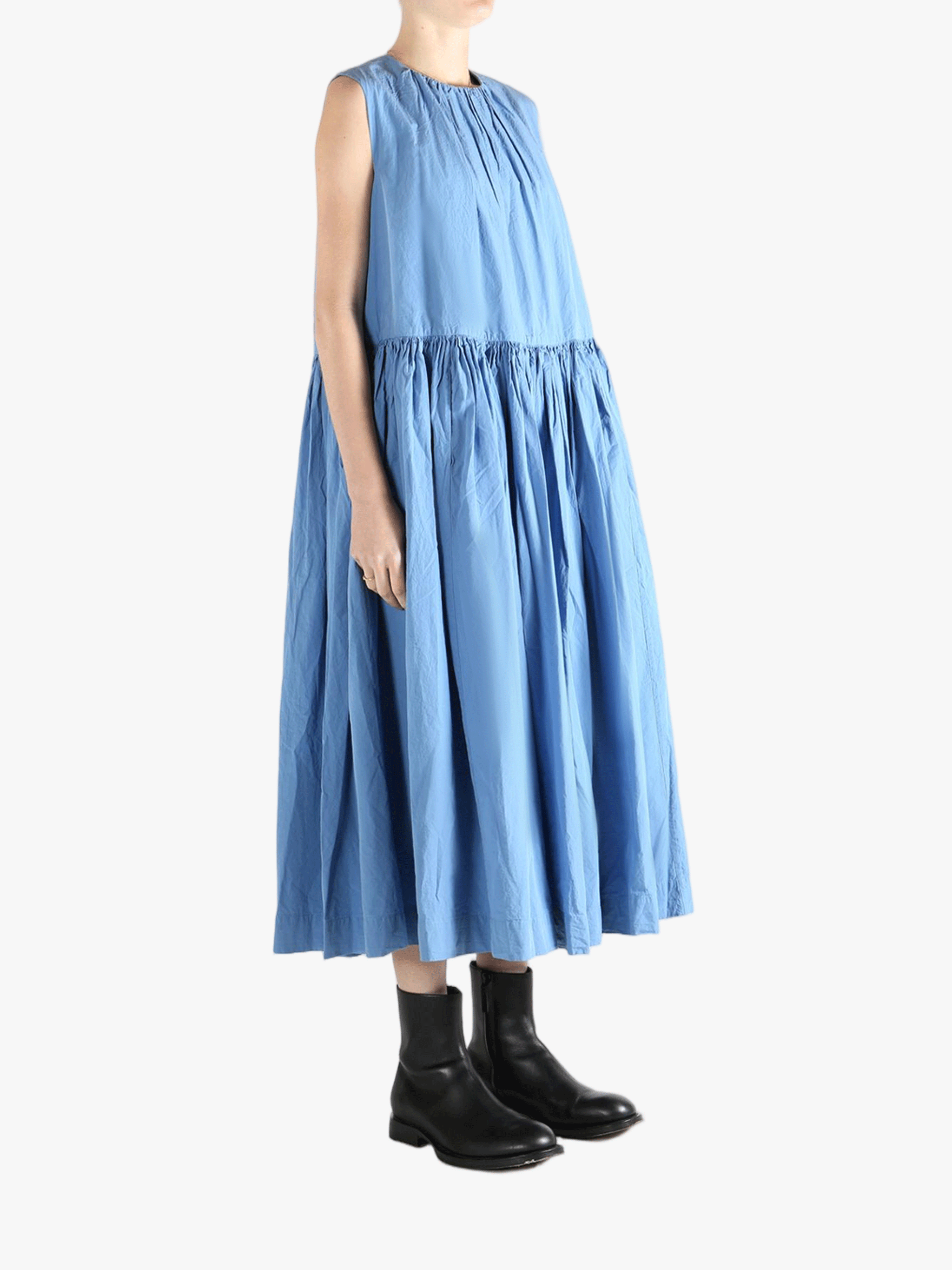 Blue dresses worn by a person, showing the dresses'fit