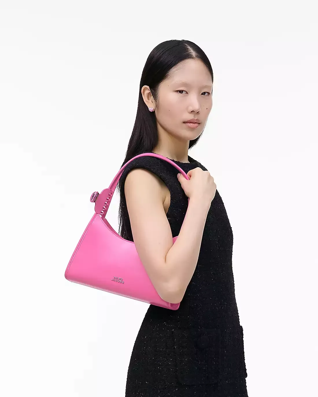 Pink bag worn by a person, showing the bag's fit