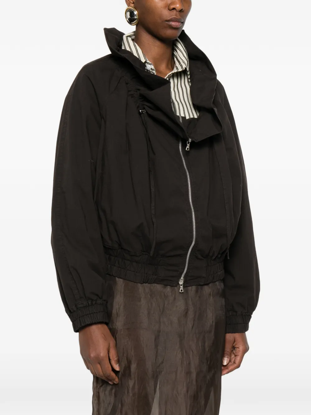 Brown jacket worn by a person, showing the jacket fit